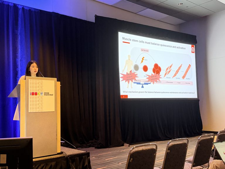 picture of a woman (Hannah) giving a talk at an ISSCR conference.